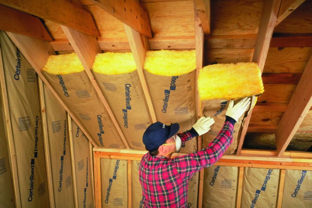 Insulation installed between the rafters of a sloped attic roof