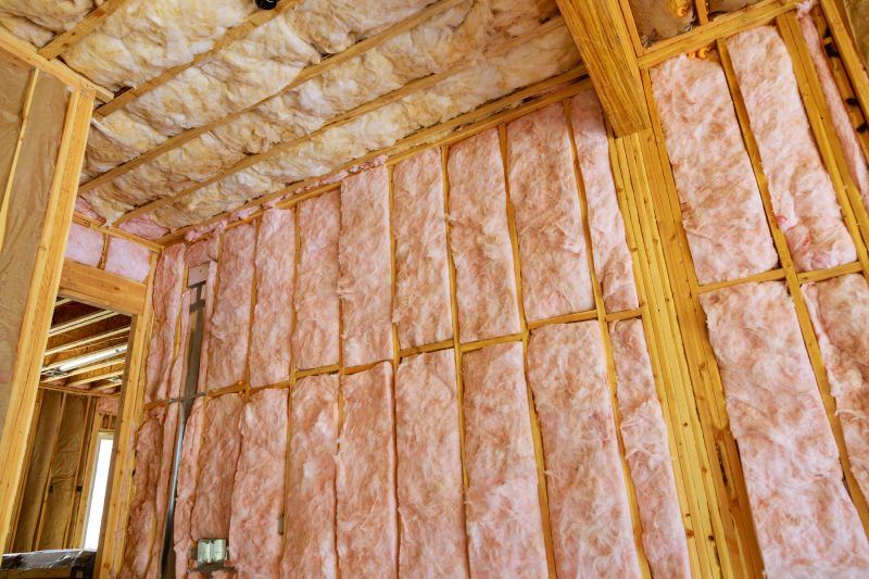 Batt insulation installed in walls and ceiling of an open room